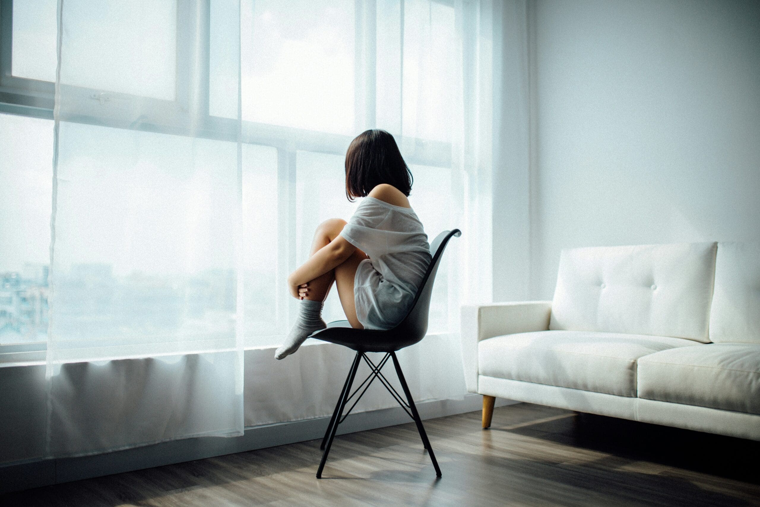 burned out depressed girl staring out the window